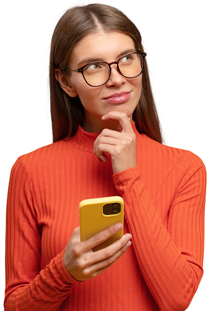 visual of a woman with an orange shirt and brown long hair, wearing glasses and holds a spmartphone in her hands